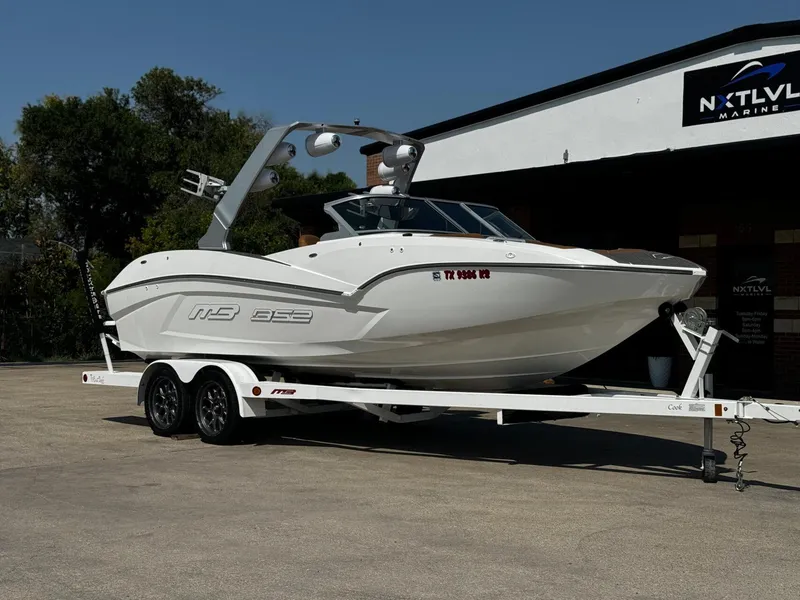 Slide: The Image of 2023 MB SPORTS B52 23 Alpha boat on trailer at NXT LVL Marine dealership. - 1