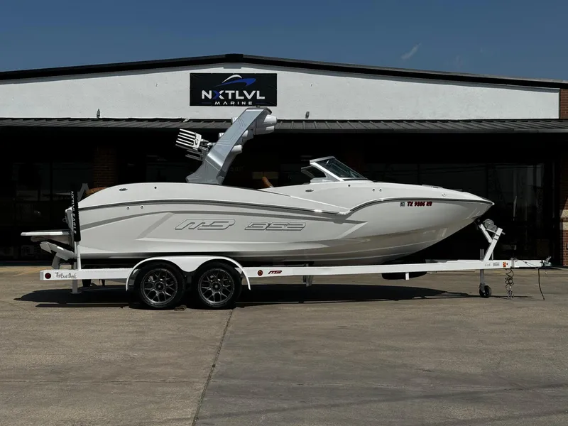 Slide: The Image of 2023 MB SPORTS B52 23 Alpha boat on trailer outside NXT LVL Marine. - 2