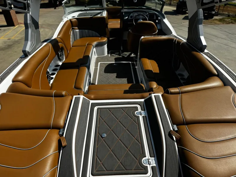Slide: The Image of Luxurious interior of 2023 MB SPORTS B52 23 Alpha boat with brown seating. - 7