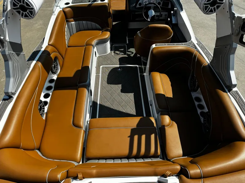 Slide: The Image of 2023 MB SPORTS B52 23 Alpha boat interior with luxurious brown leather seating. - 8