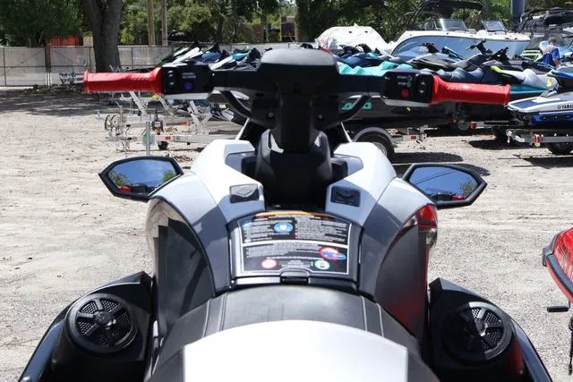 Slide: The Image of 2024 Yamaha Marine Waverunner GP HO with audio, black and torch accents, parked outdoors. - 5