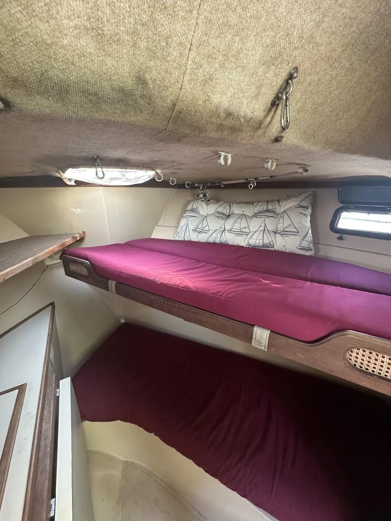 Slide: The Image of Interior cabin of 1984 Aquasport 270 Express Fisherman with bunk beds. - 19