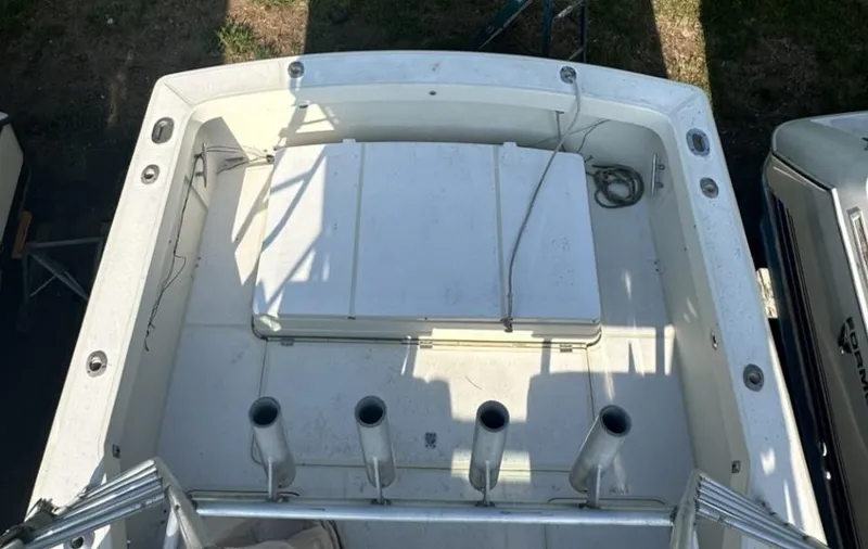 Slide: The Image of 1984 Aquasport 270 Express Fisherman boat deck with rod holders and storage compartments. - 26