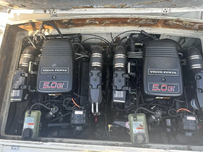 Slide: The Image of Twin Volvo Penta 5.0Gi engines in a 1984 Aquasport 270 Express Fisherman boat. - 30