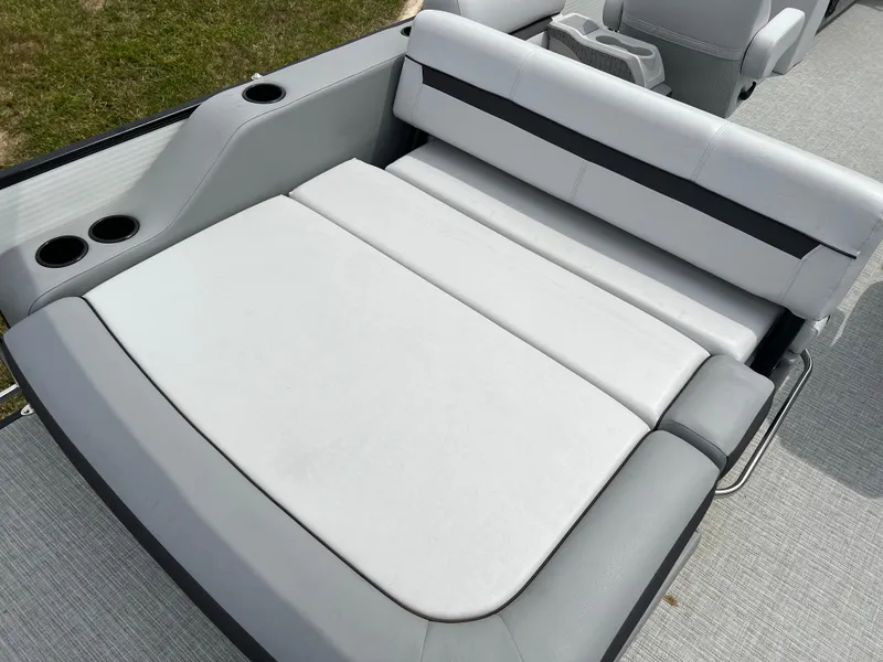Slide: The Image of 2023 Godfrey SWEETWATER 2286 SFL boat with spacious, cushioned seating area. - 15