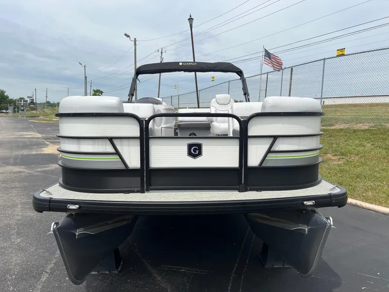 Slide: The Image of 2023 Godfrey SWEETWATER 2286 SFL pontoon boat, front view, parked on pavement. - 4