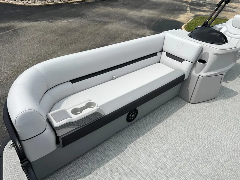 Slide: The Image of 2023 Godfrey SWEETWATER 2286 SFL boat interior with cushioned seating and cup holders. - 7