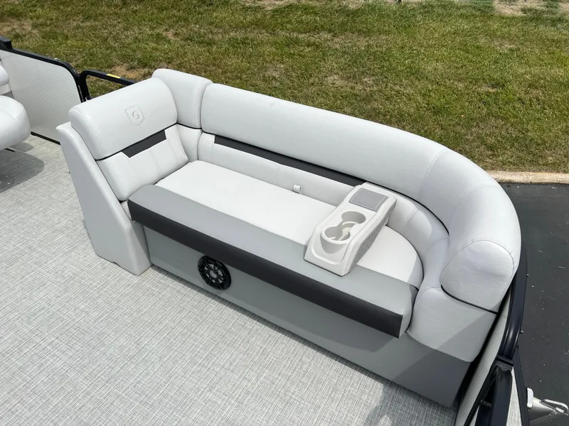 Slide: The Image of 2023 Godfrey SWEETWATER 2286 SFL boat interior with cushioned seating and cup holders. - 8