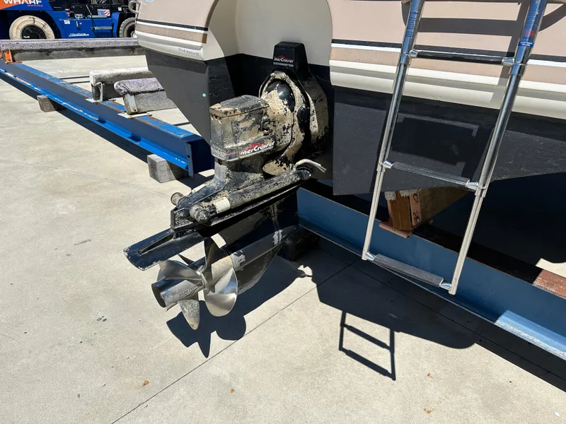 Slide: The Image of 1998 Chaparral 2335 SS boat outdrive and propeller on trailer. - 14