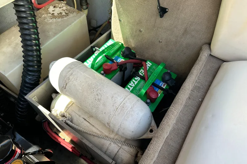 Slide: The Image of Battery compartment of a 1998 Chaparral 2335 SS boat with marine equipment. - 19