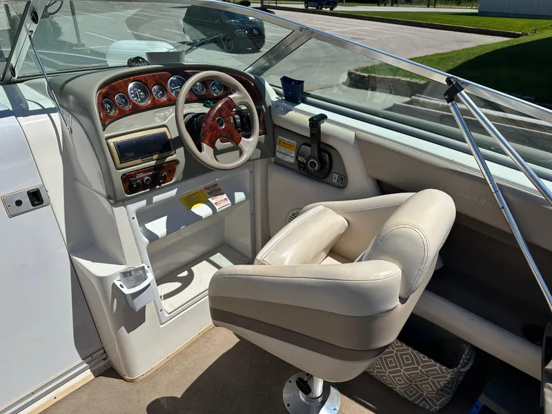 Slide: The Image of 1998 Chaparral 2335 SS boat cockpit with steering wheel and control panel. - 4
