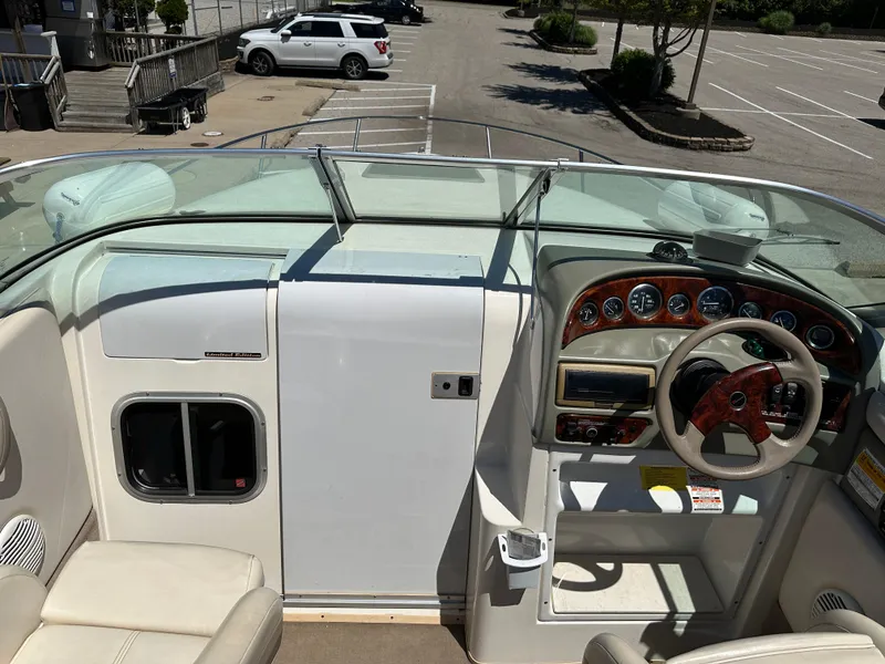 Slide: The Image of 1998 Chaparral 2335 SS boat interior with steering wheel and dashboard. - 7
