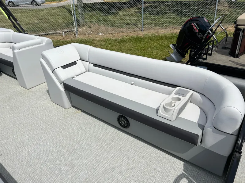 Slide: The Image of 2023 Godfrey Sweetwater 2486 C pontoon boat with cushioned seating and cup holders. - 10