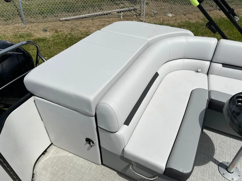 Slide: The Image of 2023 Godfrey Sweetwater 2486 C pontoon boat with white cushioned seating. - 14
