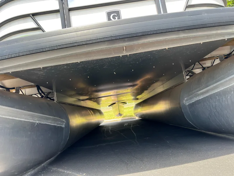 Slide: The Image of Underneath view of 2023 Godfrey Sweetwater 2486 C pontoon boat. - 21