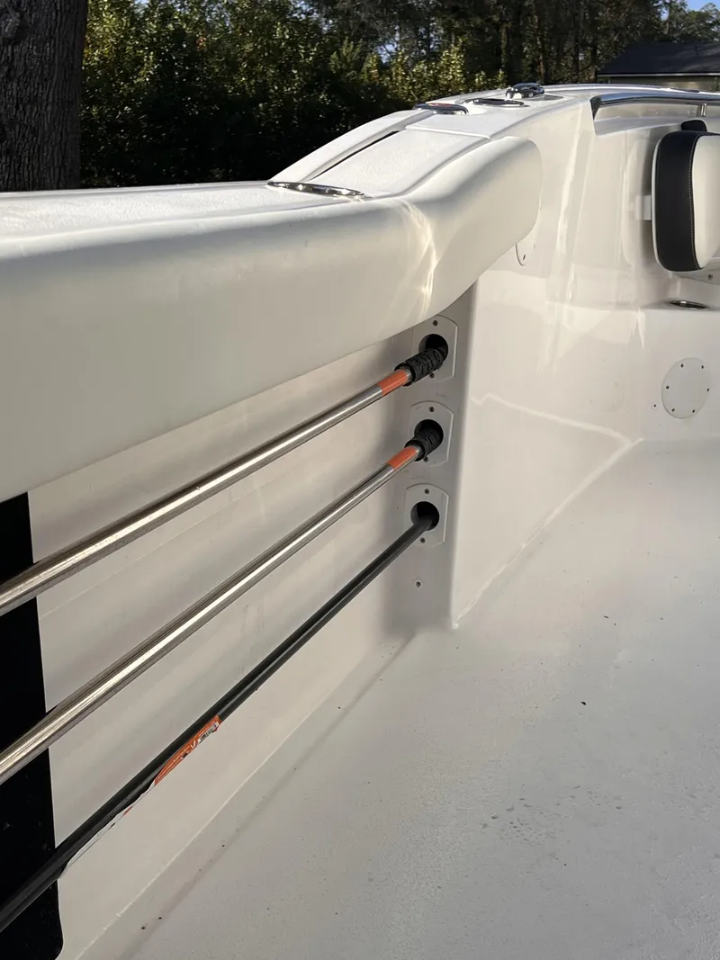 Slide: The Image of 2022 Tidewater 232 CC Adventure boat interior with rod holders. - 5