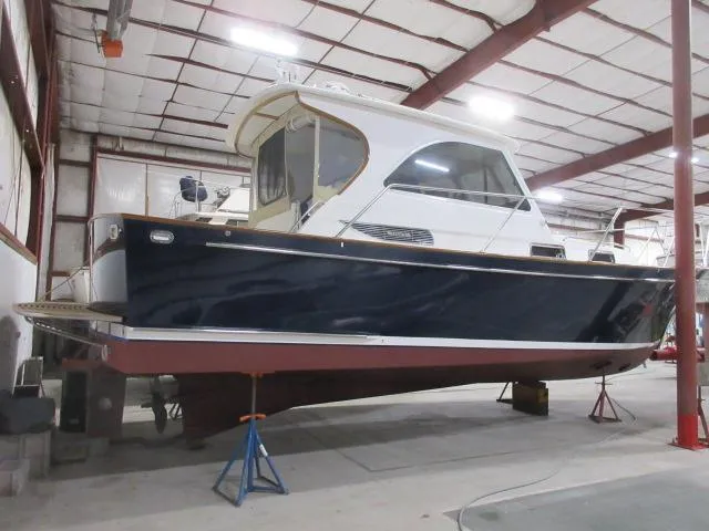 Slide: The Image of 2003 Legacy Yachts 34 Sedan in a boatyard for maintenance. - 2