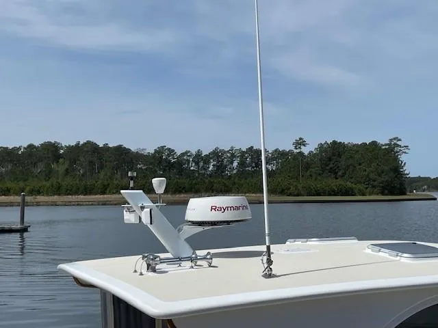 Slide: The Image of 2003 Legacy Yachts 34 Sedan on calm water with Raymarine radar. - 20