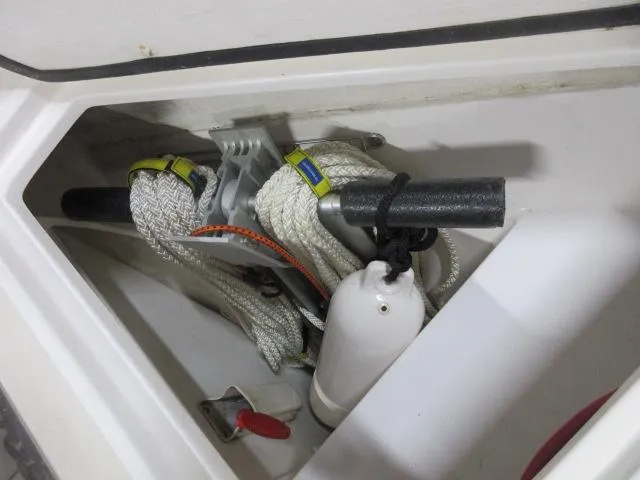 Slide: The Image of Storage compartment of a 2003 Legacy Yachts 34 Sedan with ropes and fender. - 39
