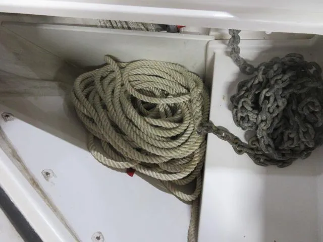 Slide: The Image of Coiled rope and chain in storage compartment of 2003 Legacy Yachts 34 Sedan. - 40