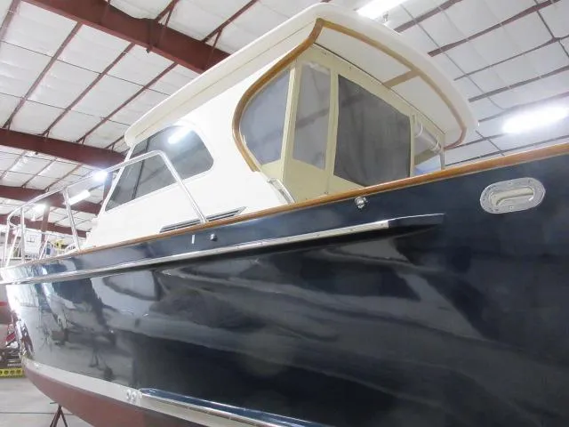 Slide: The Image of 2003 Legacy Yachts 34 Sedan in a storage facility. - 6