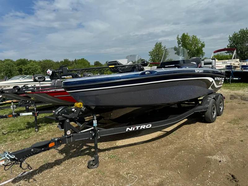 Slide: The Image of 2024 Nitro ZV19 Sport boat on a trailer in an outdoor setting. - 1