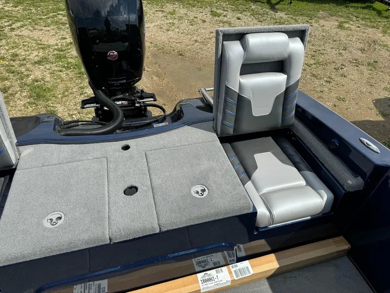 Slide: The Image of 2024 Nitro ZV19 Sport boat interior with gray and white seating and storage compartments. - 12