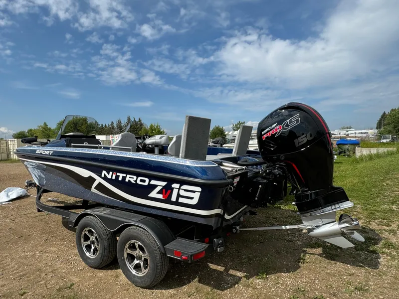 Slide: The Image of 2024 Nitro ZV19 Sport boat with powerful outboard motor on a trailer. - 3