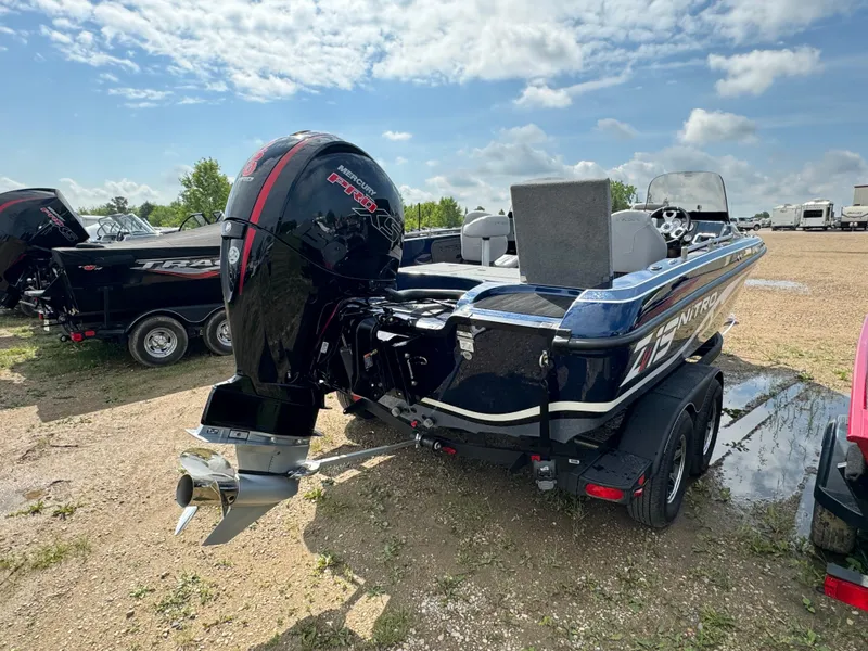 Slide: The Image of 2024 Nitro ZV19 Sport boat with powerful outboard motor on a trailer. - 4