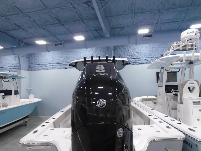 Slide: The Image of 2024 Sportsman 267OE boat with powerful engine in showroom. - 14