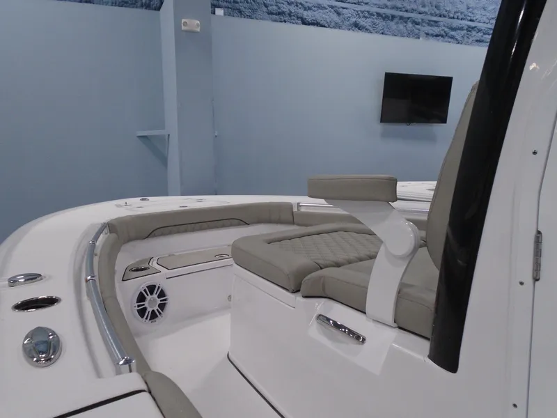 Slide: The Image of 2024 Sportsman 267OE boat interior with cushioned seating and modern design. - 4