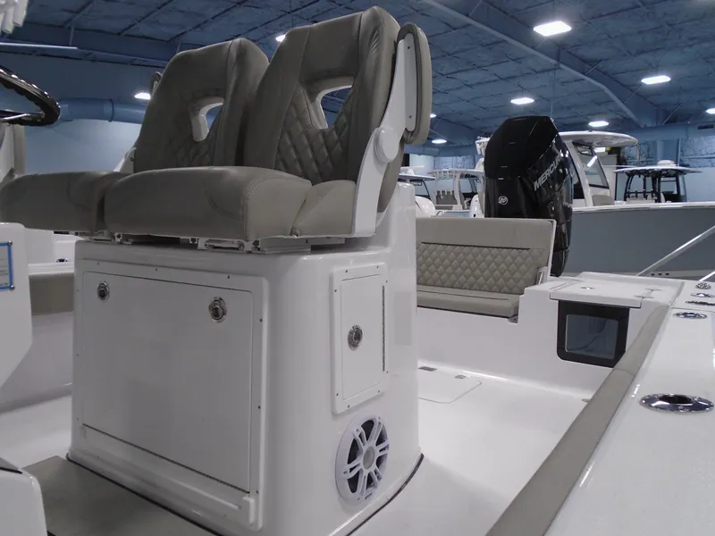 Slide: The Image of 2024 Sportsman 267OE boat interior with dual seats and storage compartment. - 6