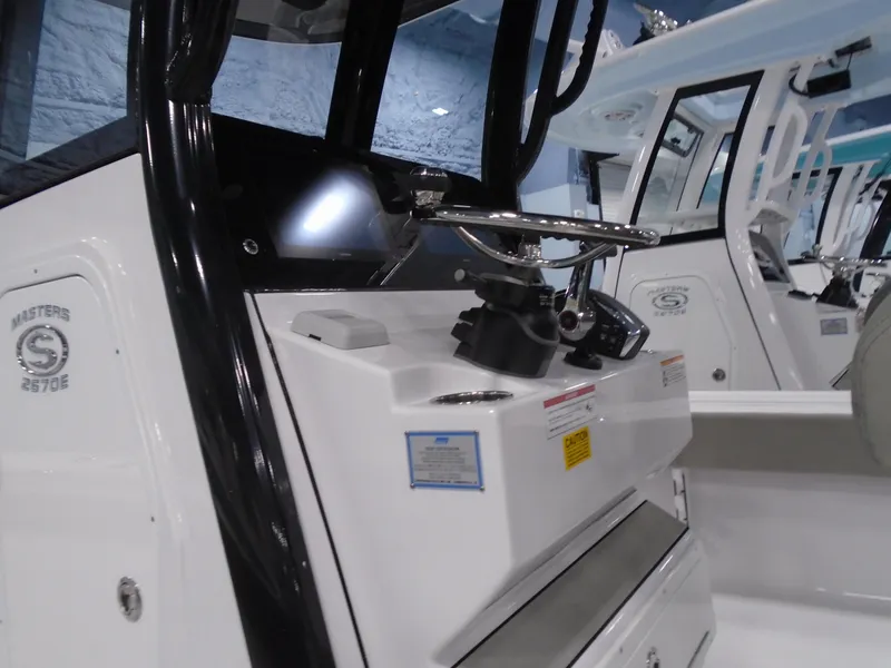 Slide: The Image of 2024 Sportsman 267OE boat console and controls. - 7