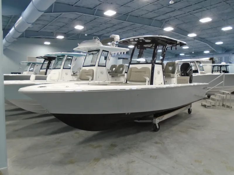 Slide: The Image of 2024 Sportsman 267OE boat in showroom, side view. - 9