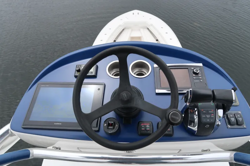 Slide: The Image of Helm of 2016 Invincible 42 Open Fisherman with navigation and control systems. - 16