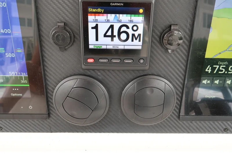 Slide: The Image of Dashboard of a 2016 Invincible 42 Open Fisherman with Garmin navigation system. - 19