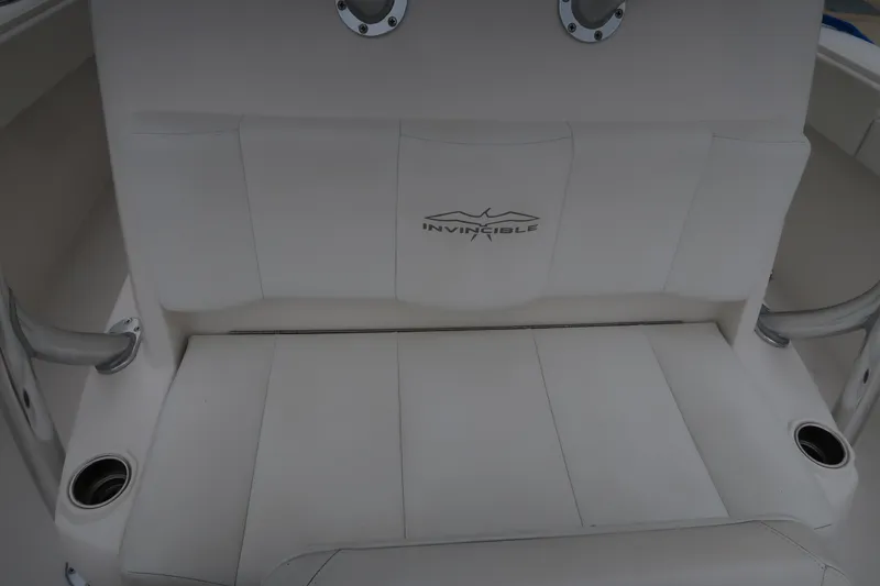Slide: The Image of 2016 Invincible 42 Open Fisherman boat seat with logo. - 43
