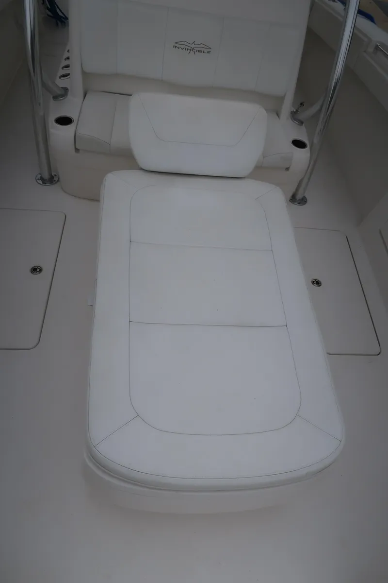 Slide: The Image of 2016 Invincible 42 Open Fisherman boat with white cushioned seating. - 45