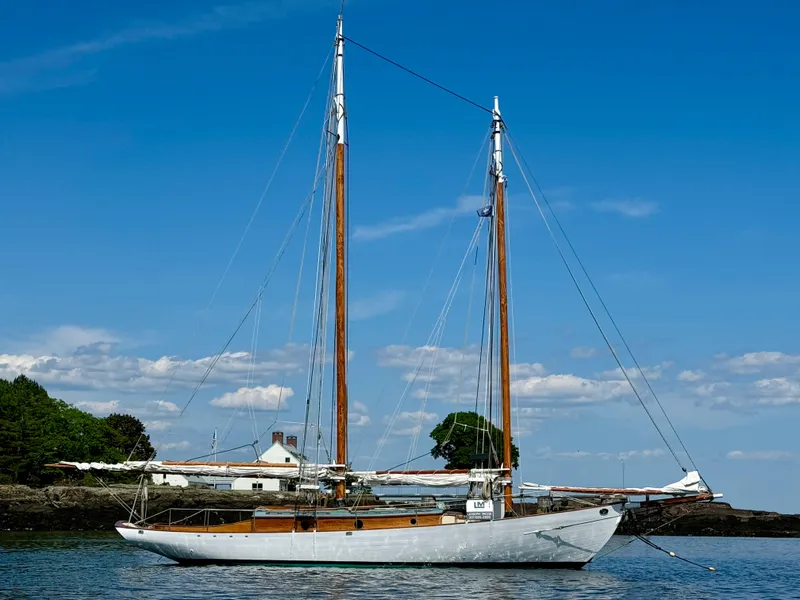 The Image of Sailing yacht "John Alden Malabar II" on calm waters, clear blue sky, 1996 model. - 0