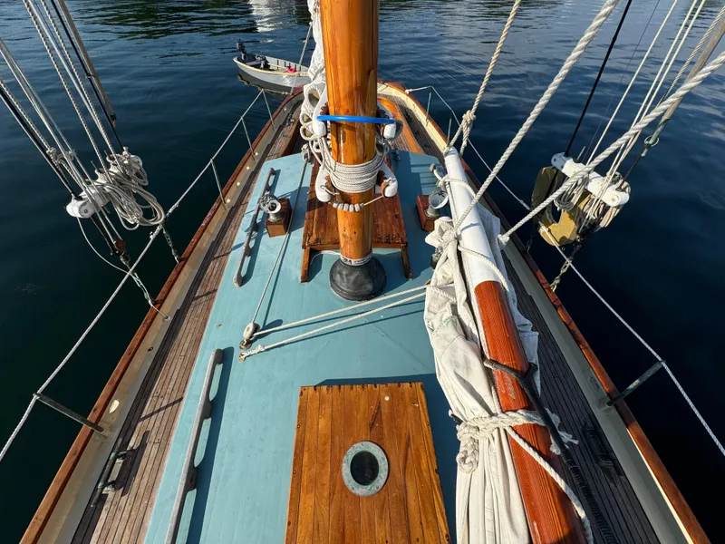 Slide: The Image of Deck view of 1996 Custom John Alden Malabar II sailboat with wooden mast and rigging. - 14