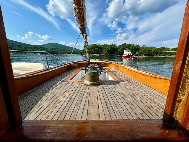 Slide: The Image of Sailing yacht John Alden Malabar II, 1996, with scenic lake and mountain backdrop. - 16