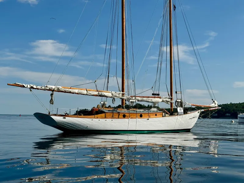 Slide: The Image of Sailing yacht "John Alden Malabar II" on calm waters, 1996 model, under clear blue sky. - 3