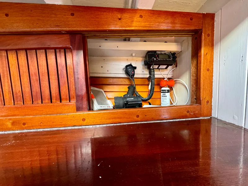 Slide: The Image of Wooden interior of a 1996 Custom John Alden Malabar II boat with communication equipment. - 30