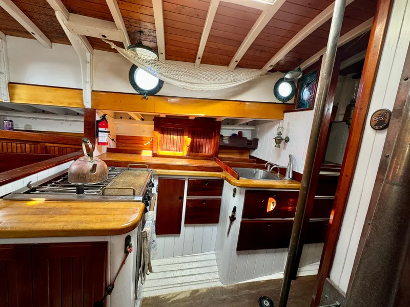 Slide: The Image of Cozy wooden interior of 1996 Custom John Alden Malabar II yacht kitchen. - 38