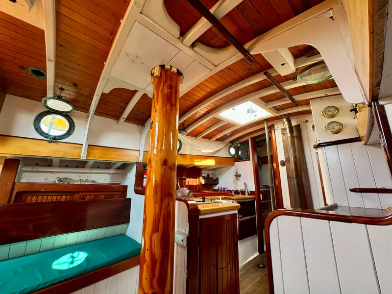 Slide: The Image of Interior of 1996 Custom John Alden Malabar II sailboat with wooden finishes and nautical decor. - 47