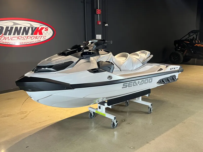 Slide: The Image of 2024 Sea-Doo GTX Limited 300 jet ski displayed at Johnny K's Powersports showroom. - 1
