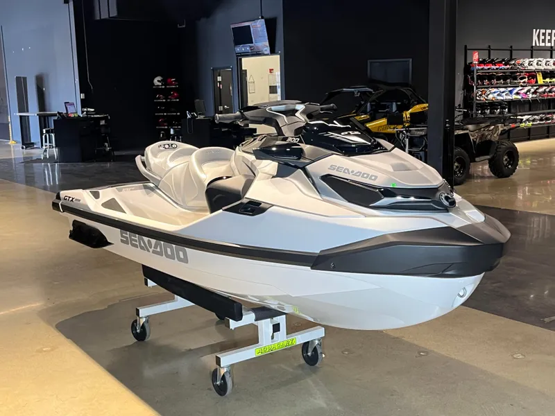 Slide: The Image of 2024 Sea-Doo GTX Limited 300 jet ski in showroom. - 2