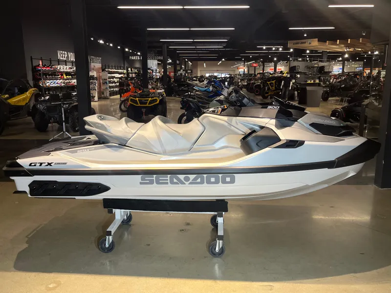 Slide: The Image of 2024 Sea-Doo GTX Limited 300 jet ski in showroom. - 3