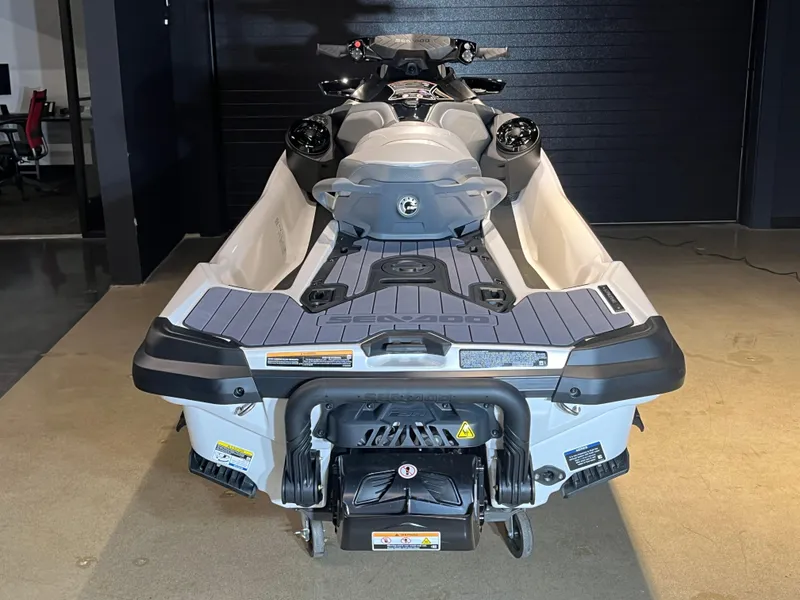Slide: The Image of 2024 Sea-Doo GTX Limited 300 jet ski, rear view in showroom. - 5