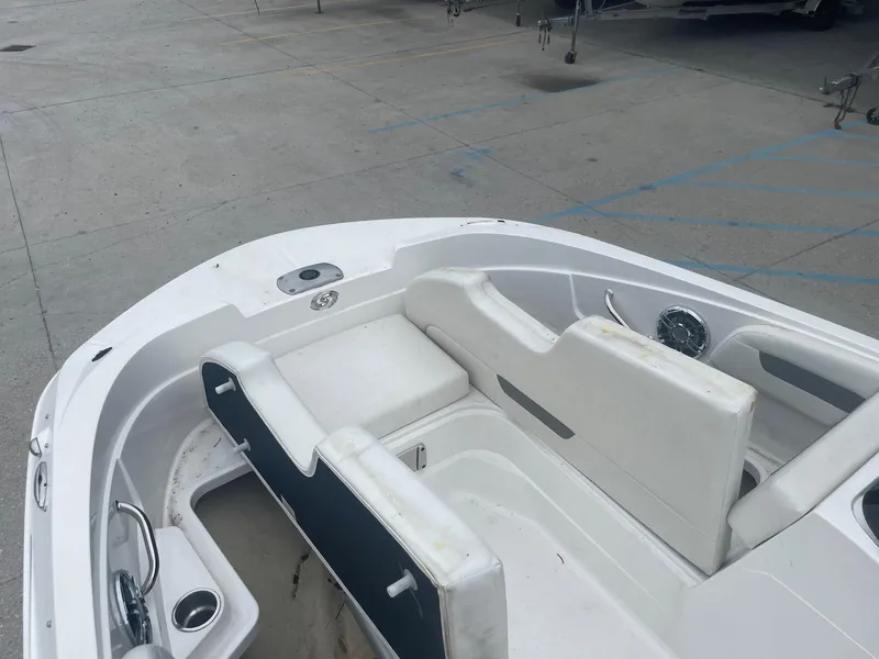 Slide: The Image of 2022 Hurricane SS185 OB boat interior with white seating and cup holders. - 13